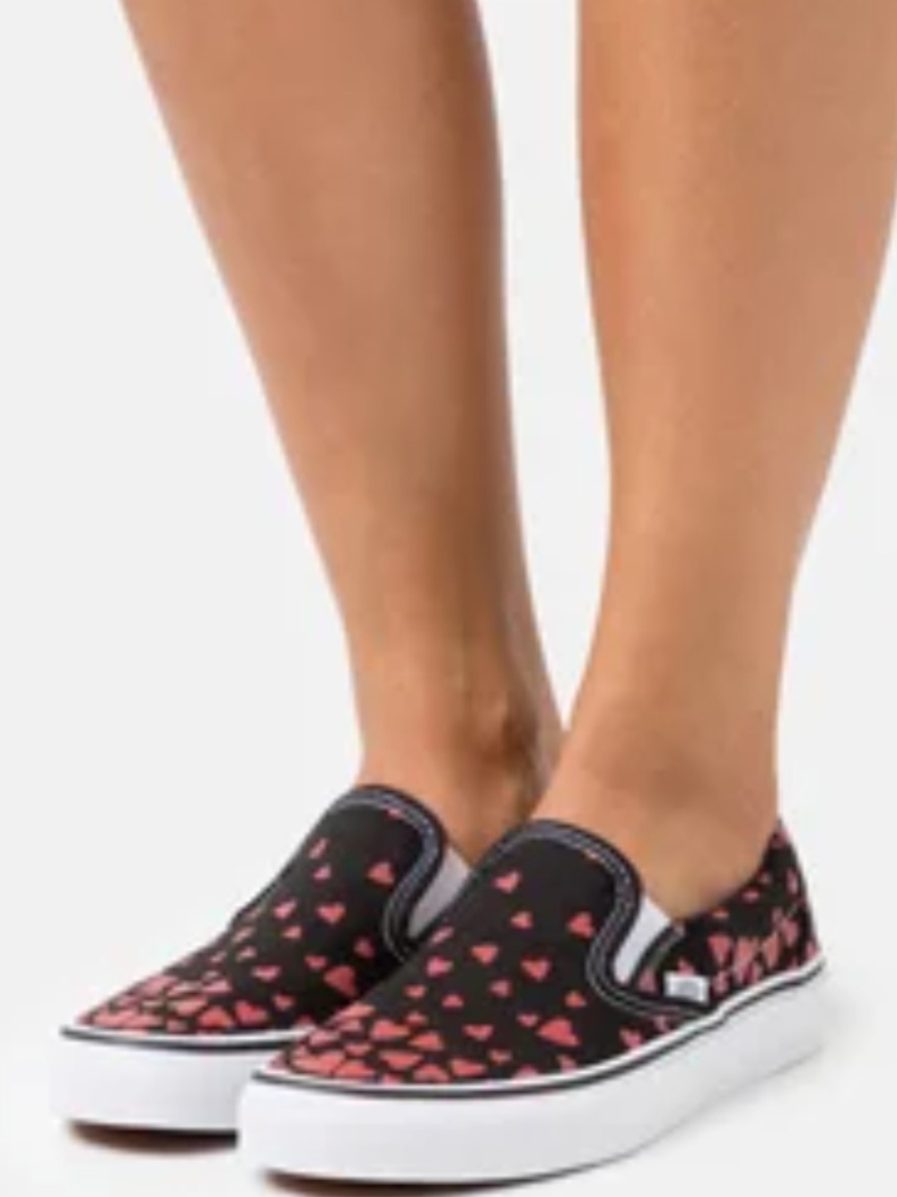Vans Slip-On Sneakers in Black with Pink Heart Print